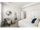 Comfortable bedroom with tray ceiling featuring seating area and lots of light at 1172 Edwin Ln, Sugar Hill, GA 30518