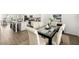 Open-concept dining area connects to the modern kitchen, perfect for entertaining and Gathering meals at 1172 Edwin Ln, Sugar Hill, GA 30518