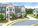 Street view showcasing townhomes with brick and sidewalks in a well-maintained neighborhood at 1172 Edwin Ln, Sugar Hill, GA 30518