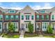 Charming brick townhome with black shutters and landscaped front yard, offering curb appeal at 1172 Edwin Ln, Sugar Hill, GA 30518