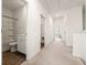 Hallway showing bathroom, closets and access to other rooms at 1172 Edwin Ln, Sugar Hill, GA 30518