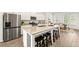 Modern kitchen features stainless steel appliances, granite countertops, and a large island at 1172 Edwin Ln, Sugar Hill, GA 30518