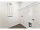 Laundry room features wooden floor, mounted shelving and hookups at 1172 Edwin Ln, Sugar Hill, GA 30518