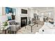 Bright living room showcases a fireplace and an open layout connected to the kitchen area at 1172 Edwin Ln, Sugar Hill, GA 30518