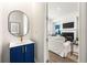 Stylishly designed powder room with a custom vanity and modern mirror at 1172 Edwin Ln, Sugar Hill, GA 30518