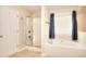 Bathroom featuring a bathtub, shower, and tile flooring, offering comfort and style at 2010 Hickory Station Cir, Snellville, GA 30078