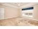 Spacious bedroom with large window and neutral carpet at 2010 Hickory Station Cir, Snellville, GA 30078