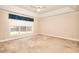 Spacious bedroom features large window and neutral carpet at 2010 Hickory Station Cir, Snellville, GA 30078
