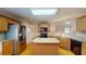 Well-lit kitchen featuring stainless steel appliances, tile backsplash, and a center island at 2010 Hickory Station Cir, Snellville, GA 30078