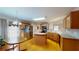 Bright kitchen features wood cabinets, stainless steel appliances, and an island with wood floors at 2010 Hickory Station Cir, Snellville, GA 30078