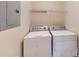 Laundry room features modern appliances and storage at 2010 Hickory Station Cir, Snellville, GA 30078