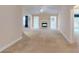 Open concept living room with a fireplace and multiple openings to other rooms in the house at 2010 Hickory Station Cir, Snellville, GA 30078