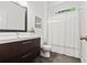Modern bathroom featuring a sleek vanity, a coordinated shower curtain, and contemporary fixtures, designed for comfort at 2089 College Ne Ave, Atlanta, GA 30317