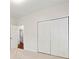Neutral bedroom featuring large closet doors and a connecting door, offering storage and easy access at 2089 College Ne Ave, Atlanta, GA 30317