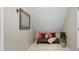 Cozy bonus room or reading nook with a comfortable bench, decorative pillows, and soft lighting at 2089 College Ne Ave, Atlanta, GA 30317