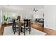 Bright dining room with hardwood floors, large windows, and view of the living room at 2089 College Ne Ave, Atlanta, GA 30317