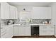 Modern kitchen featuring white cabinets, stainless steel appliances, and stylish backsplash at 2089 College Ne Ave, Atlanta, GA 30317