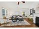 Cozy living room featuring hardwood floors, a comfortable sofa, and abundant natural light at 2089 College Ne Ave, Atlanta, GA 30317