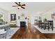 Sunlit living room boasts beautiful hardwood floors, fireplace, and an open floor plan at 2089 College Ne Ave, Atlanta, GA 30317