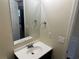 A half bathroom featuring a sink with a mirror, perfect for guests and everyday use at 3827 Micah Ln, Ellenwood, GA 30294