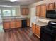 Well-equipped kitchen with granite countertops, stainless appliances, and wood cabinetry at 3827 Micah Ln, Ellenwood, GA 30294