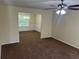 Open living area featuring neutral walls and an adjacent dining space, great for entertaining at 3827 Micah Ln, Ellenwood, GA 30294
