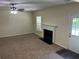 Inviting living room featuring a fireplace, neutral walls, and ceiling fan for comfort at 3827 Micah Ln, Ellenwood, GA 30294
