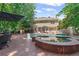 Beautiful backyard featuring a pool, spa, and brick patio, ideal for outdoor entertaining and relaxation at 3231 Connemara Trce, Lawrenceville, GA 30044