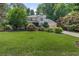 Charming two-story home with a well-manicured lawn and lush landscaping at 3231 Connemara Trce, Lawrenceville, GA 30044