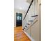 Welcoming foyer with hardwood floors, staircase, and a decorative front door with leaded glass at 3231 Connemara Trce, Lawrenceville, GA 30044