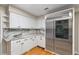 Kitchen area showcasing stainless steel refrigerator and custom cabinets at 3231 Connemara Trce, Lawrenceville, GA 30044