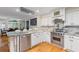 Gourmet kitchen featuring marble countertops, stainless steel appliances, and custom cabinetry at 3231 Connemara Trce, Lawrenceville, GA 30044