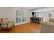 Spacious living room with hardwood floors, plantation shutters, and comfortable seating at 3231 Connemara Trce, Lawrenceville, GA 30044