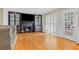 Inviting living room featuring hardwood floors, fireplace with built-ins, and bright windows at 3231 Connemara Trce, Lawrenceville, GA 30044