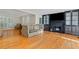 Spacious living room boasts hardwood floors and a fireplace with decorative cabinets at 3231 Connemara Trce, Lawrenceville, GA 30044