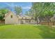 Expansive backyard features lush lawn and manicured landscaping at 3894 Land O Lakes Ne Dr, Atlanta, GA 30342