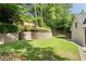 Well-maintained backyard with terraced retaining wall and manicured landscaping at 3894 Land O Lakes Ne Dr, Atlanta, GA 30342