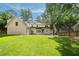 Expansive backyard features lush lawn and manicured landscaping at 3894 Land O Lakes Ne Dr, Atlanta, GA 30342