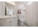 Bathroom with white vanity and a shower and tub combination behind a curtain at 3894 Land O Lakes Ne Dr, Atlanta, GA 30342