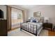 Bedroom with neutral colors, window with blinds, and furniture at 3894 Land O Lakes Ne Dr, Atlanta, GA 30342