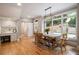 Dining room with built-in desk, sliding door, large windows, and a chandelier at 3894 Land O Lakes Ne Dr, Atlanta, GA 30342
