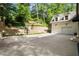 Home with a basketball hoop and a two-car garage at 3894 Land O Lakes Ne Dr, Atlanta, GA 30342