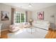 Charming living room featuring neutral colors and lots of light from the large windows at 3894 Land O Lakes Ne Dr, Atlanta, GA 30342