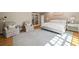 Sunny main bedroom featuring hardwood floors, sitting area, and bright natural light at 3894 Land O Lakes Ne Dr, Atlanta, GA 30342