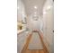 Hallway with ample storage cabinets, drawers, a bench, and hardwood floors at 3894 Land O Lakes Ne Dr, Atlanta, GA 30342