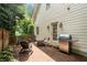 Inviting brick patio with grilling area and a cozy seating space at 3894 Land O Lakes Ne Dr, Atlanta, GA 30342