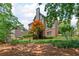 Landscaped backyard with mature trees and vibrant foliage at 7047 Bennington Ln, Cumming, GA 30041