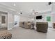 Spacious basement with neutral carpeting, recessed lighting, and a comfortable seating arrangement for relaxation at 7047 Bennington Ln, Cumming, GA 30041