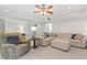 Cozy basement featuring plush carpeting, recessed lighting, and comfortable sectional seating for relaxation at 7047 Bennington Ln, Cumming, GA 30041
