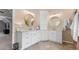 Beautiful bathroom with double vanity, neutral walls, and decorative mirrors at 7047 Bennington Ln, Cumming, GA 30041